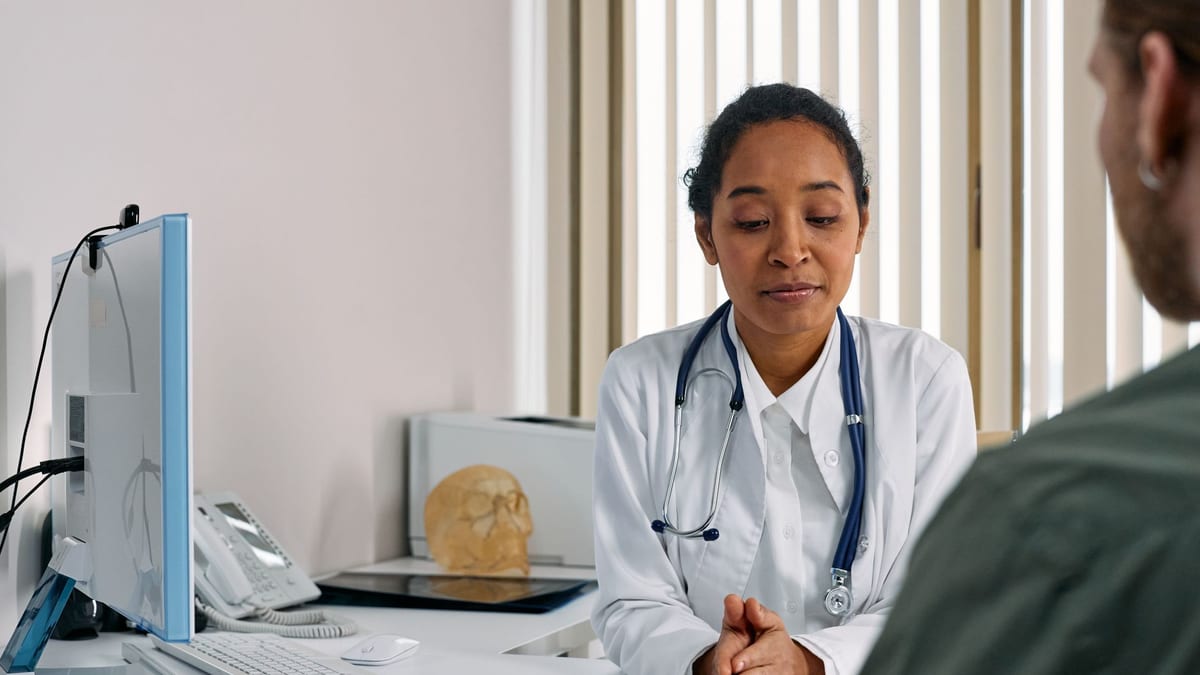 A doctor and patient in a consultation, the moment to ask the right questions