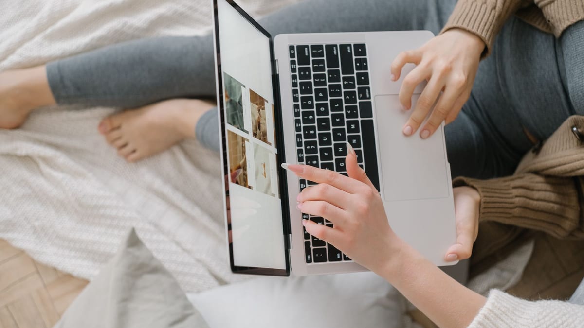 A woman at a laptop researching med spas before booking