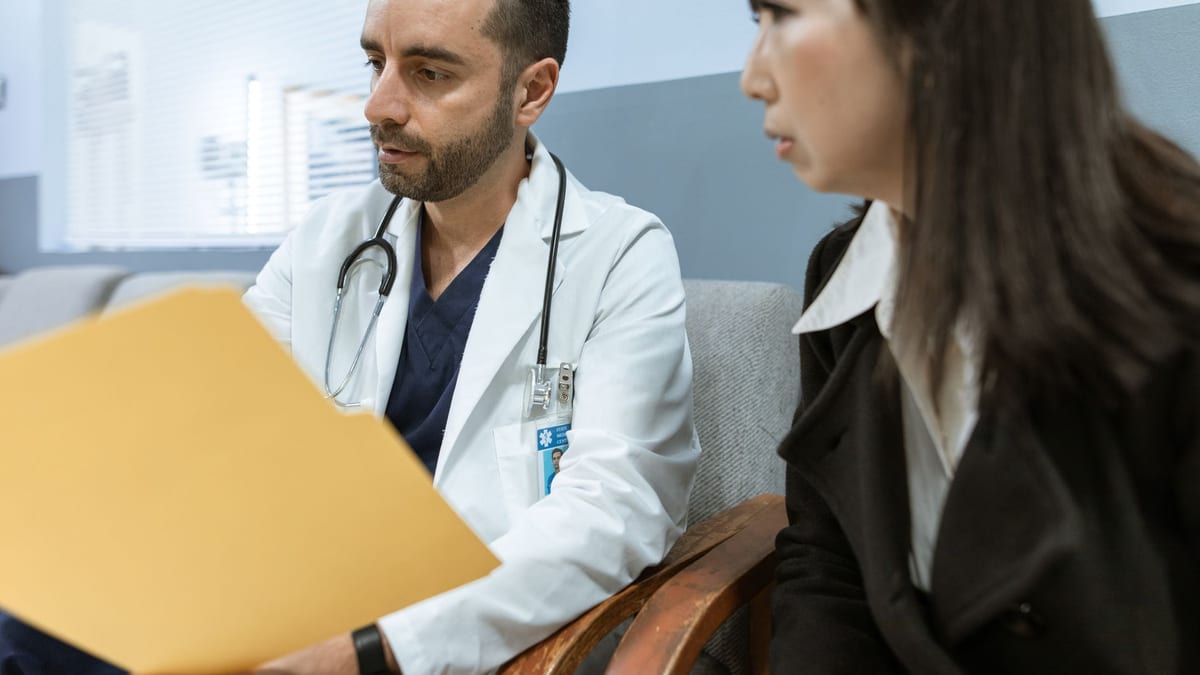 A surgeon in consultation, the setting for a breast augmentation quote