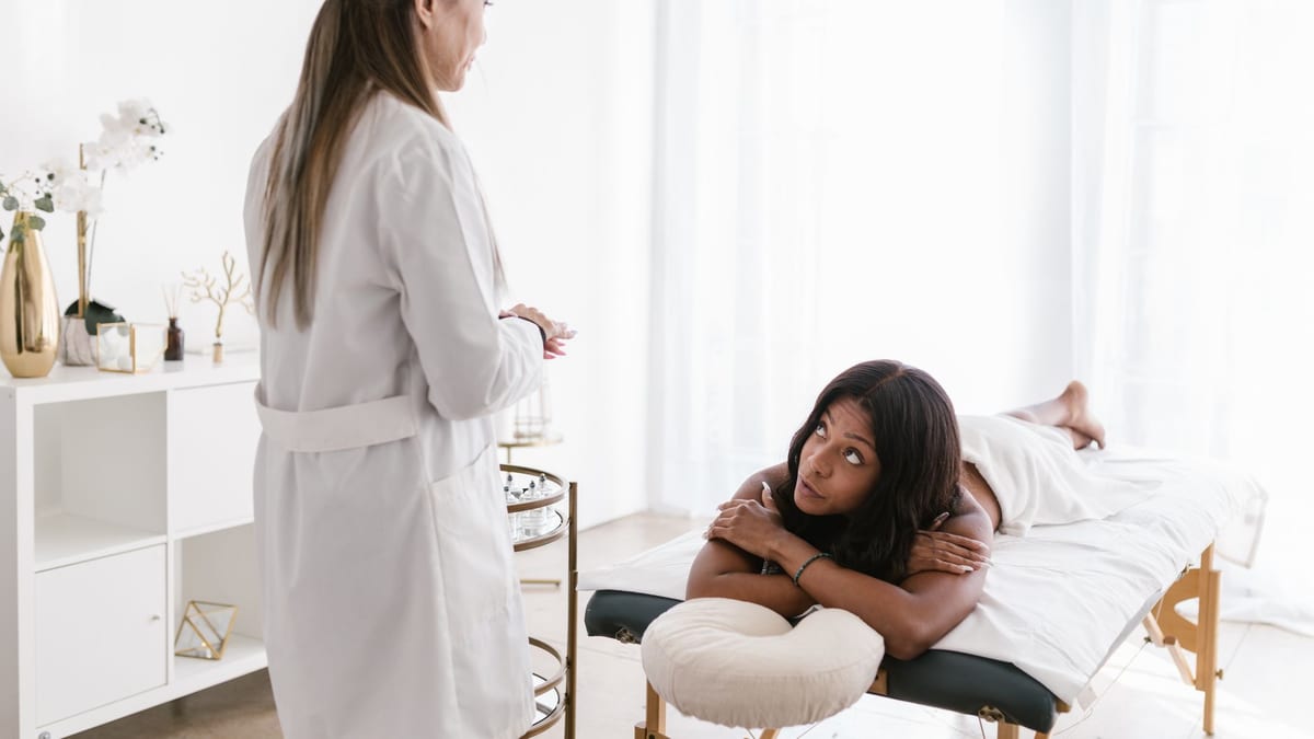 A white treatment bed in an aesthetic clinic