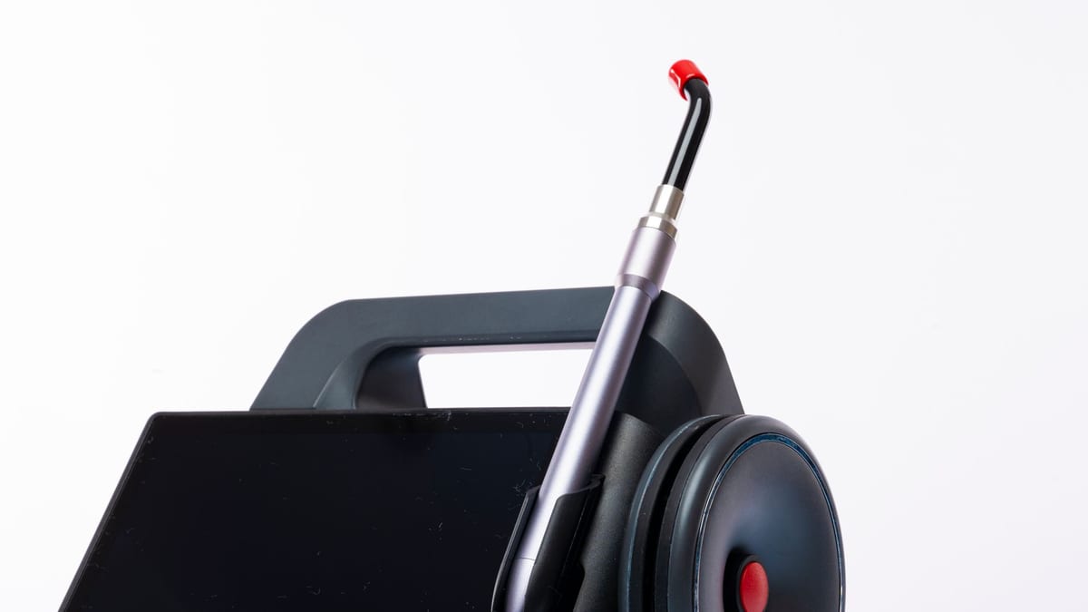 A skin tightening laser handpiece in a treatment room