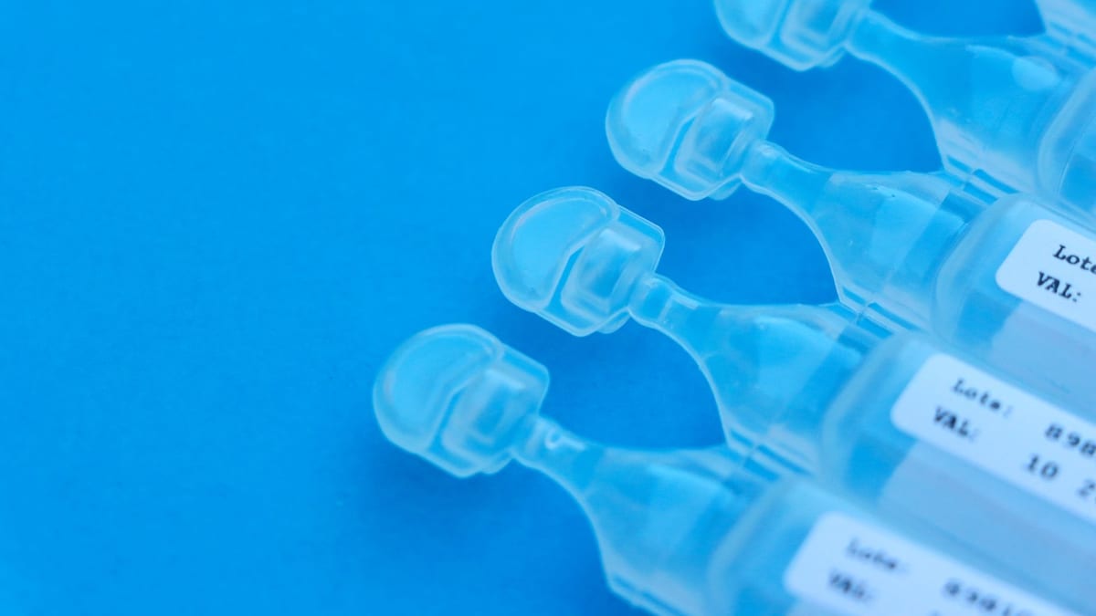 An injectable vial on a clean clinic surface