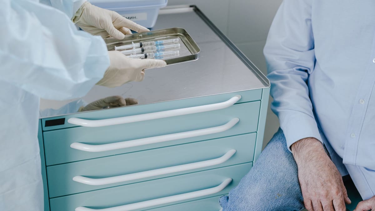 Two syringes side by side on a medical tray